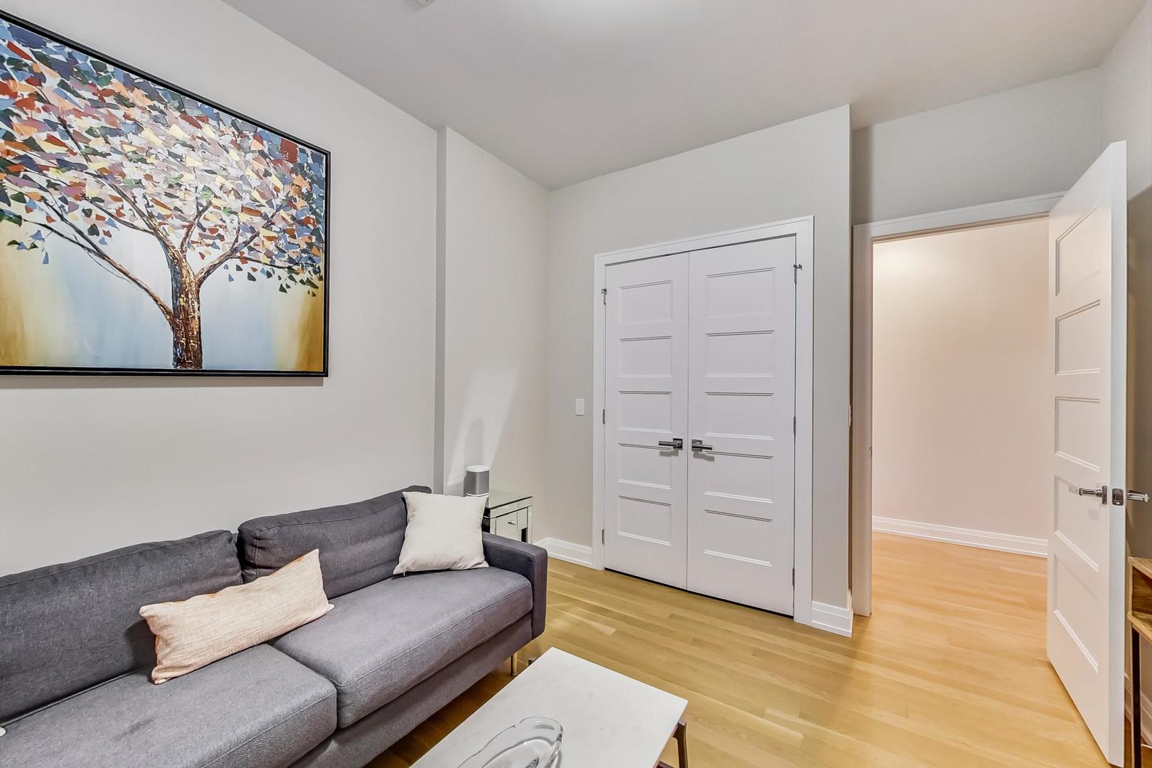 1525 West Fry Street, Unit 2 Chicago, IL 60642 - Photo 20 of 33 a living room with furniture and a walk in closet