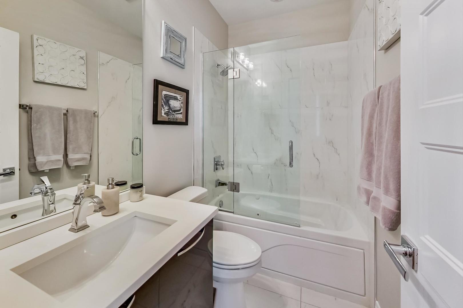 1525 West Fry Street, Unit 2 Chicago, IL 60642 - Photo 22 of 33 a bathroom with a sink toilet and shower