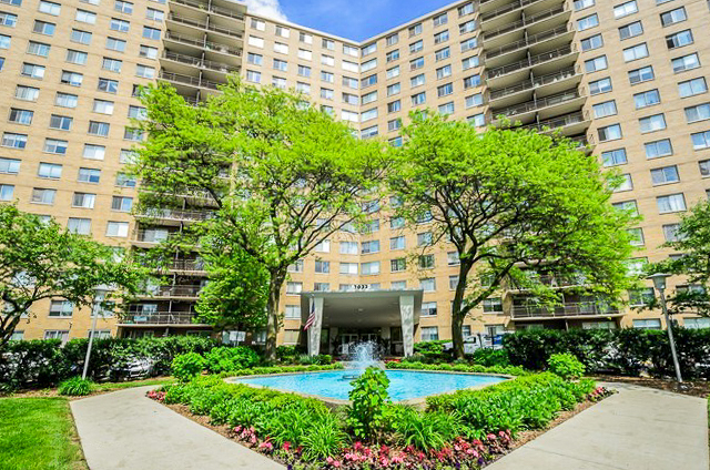 7033 North Kedzie Avenue, Unit 1413 Chicago, IL 60645 - Photo 1 of 18 a front view of a building with garden
