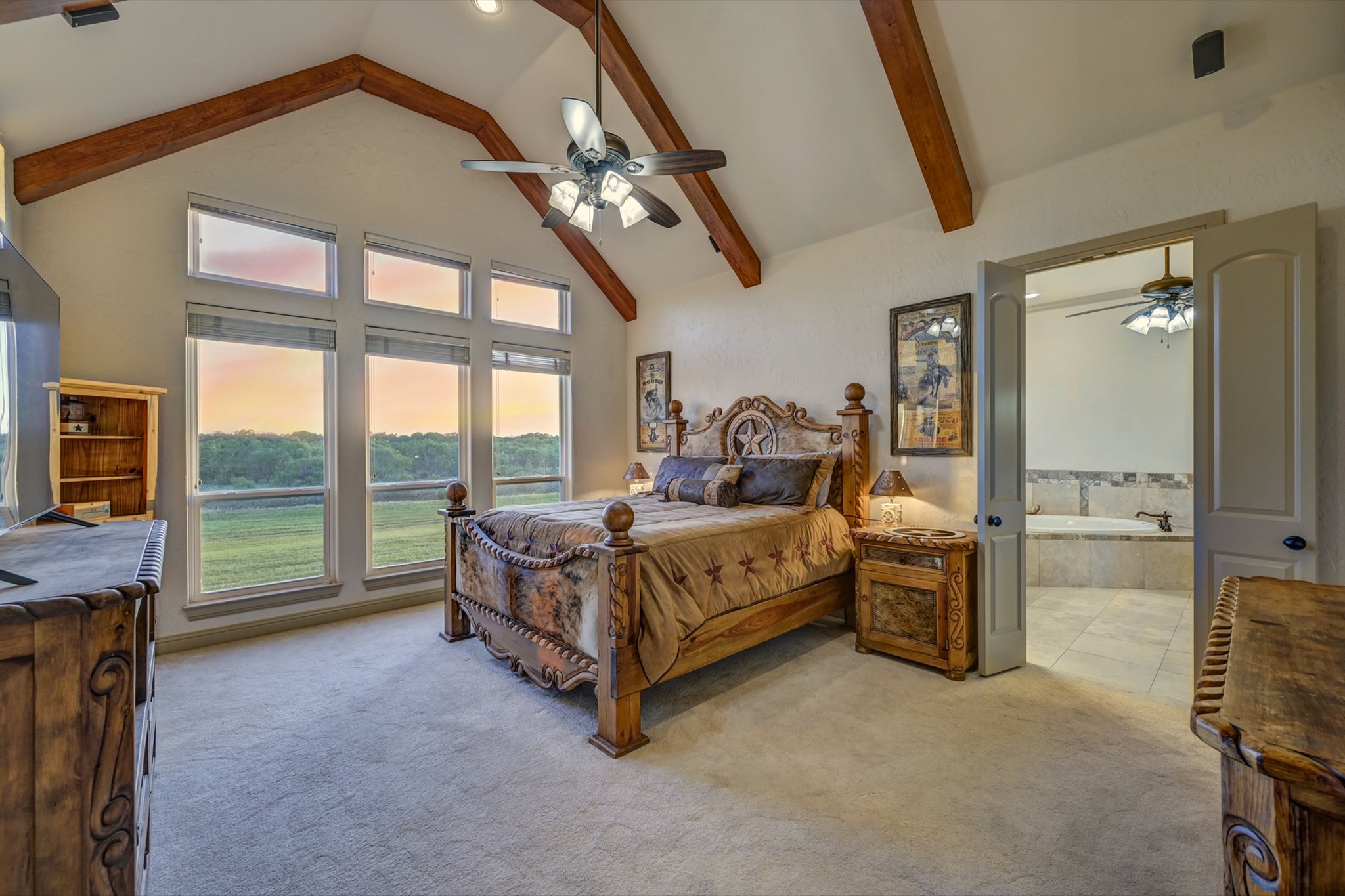 18601 County Road 214 Brookesmith, TX 76827 - Photo 13 of 39 Main House: Primary Bedroom with cathedral ceiling and wood beams