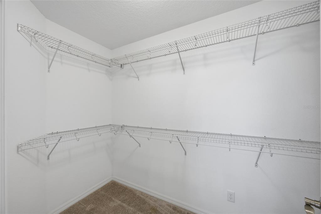 19656 Long Lake Ranch Boulevard Lutz, FL 33558 - Photo 17 of 44 a view of a room with racks on the wall