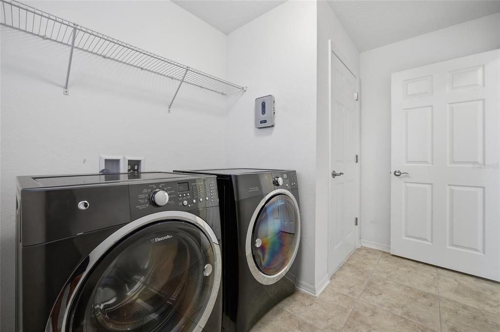 19656 Long Lake Ranch Boulevard Lutz, FL 33558 - Photo 24 of 44 a utility room with dryer and washer