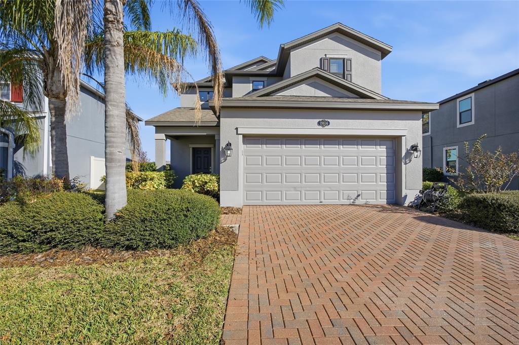 19656 Long Lake Ranch Boulevard Lutz, FL 33558 - Photo 44 of 44 a front view of a house with a yard