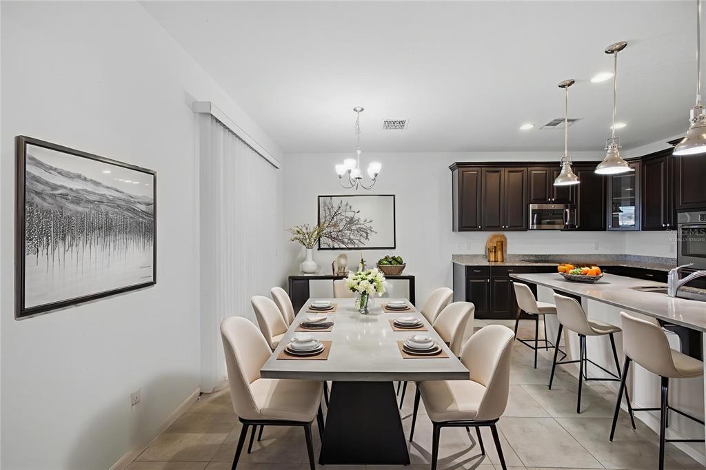19656 Long Lake Ranch Boulevard Lutz, FL 33558 - Photo 7 of 44 a view of a dining room with furniture