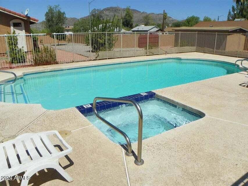 1336 East Mountain View Road, Unit 202 Phoenix, AZ 85020 - Photo 22 of 23 a view of a swimming pool with a lake view