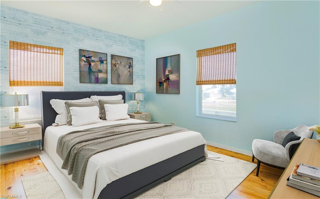 12277 Boat Shell Drive Matlacha Isles, FL 33991 - Photo 32 of 46 a bedroom with bed and a window