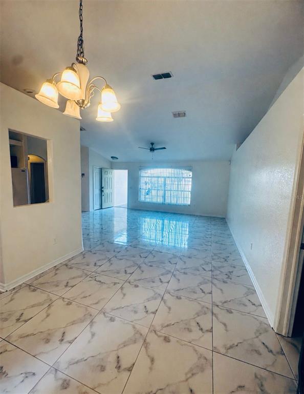 8344 Dorsey Street Spring Hill, FL 34608 - Photo 3 of 10 a view of an empty room and window