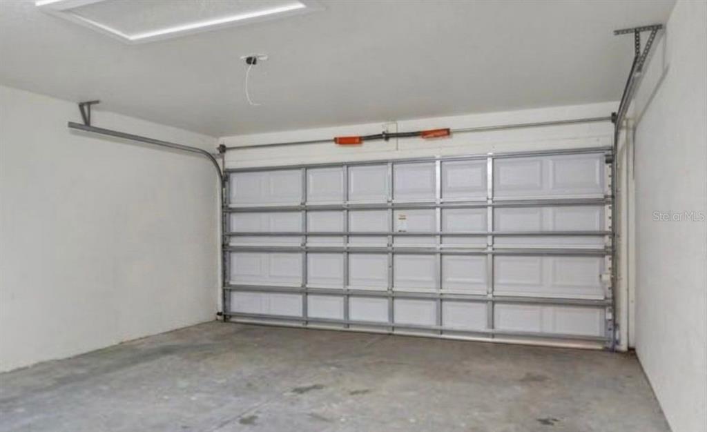 8344 Dorsey Street Spring Hill, FL 34608 - Photo 10 of 10 a view of a room with rack on the wall