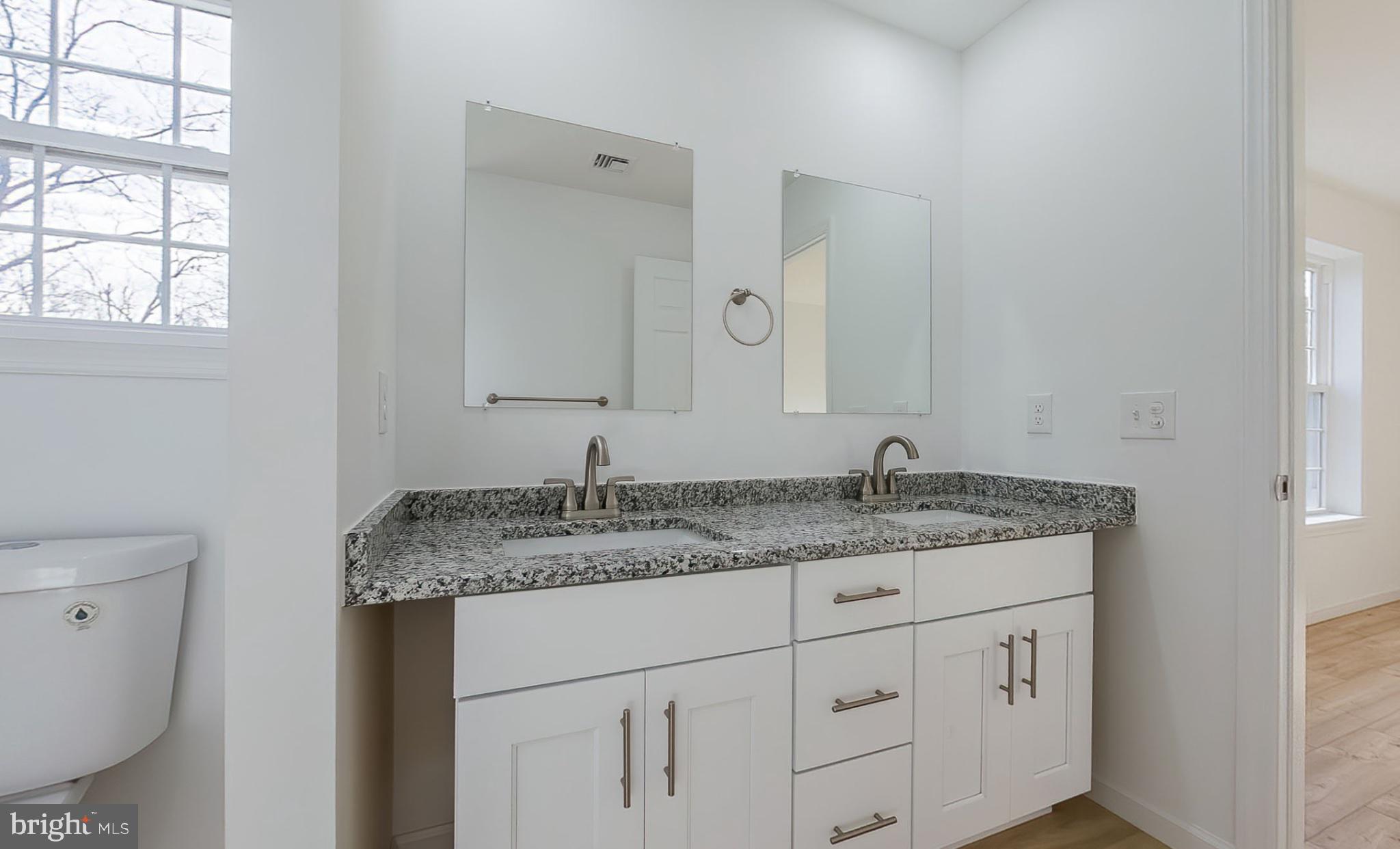 13 Nicole Lane Hazleton, PA 18202 - Photo 17 of 23 a bathroom with a granite countertop sink and a mirror