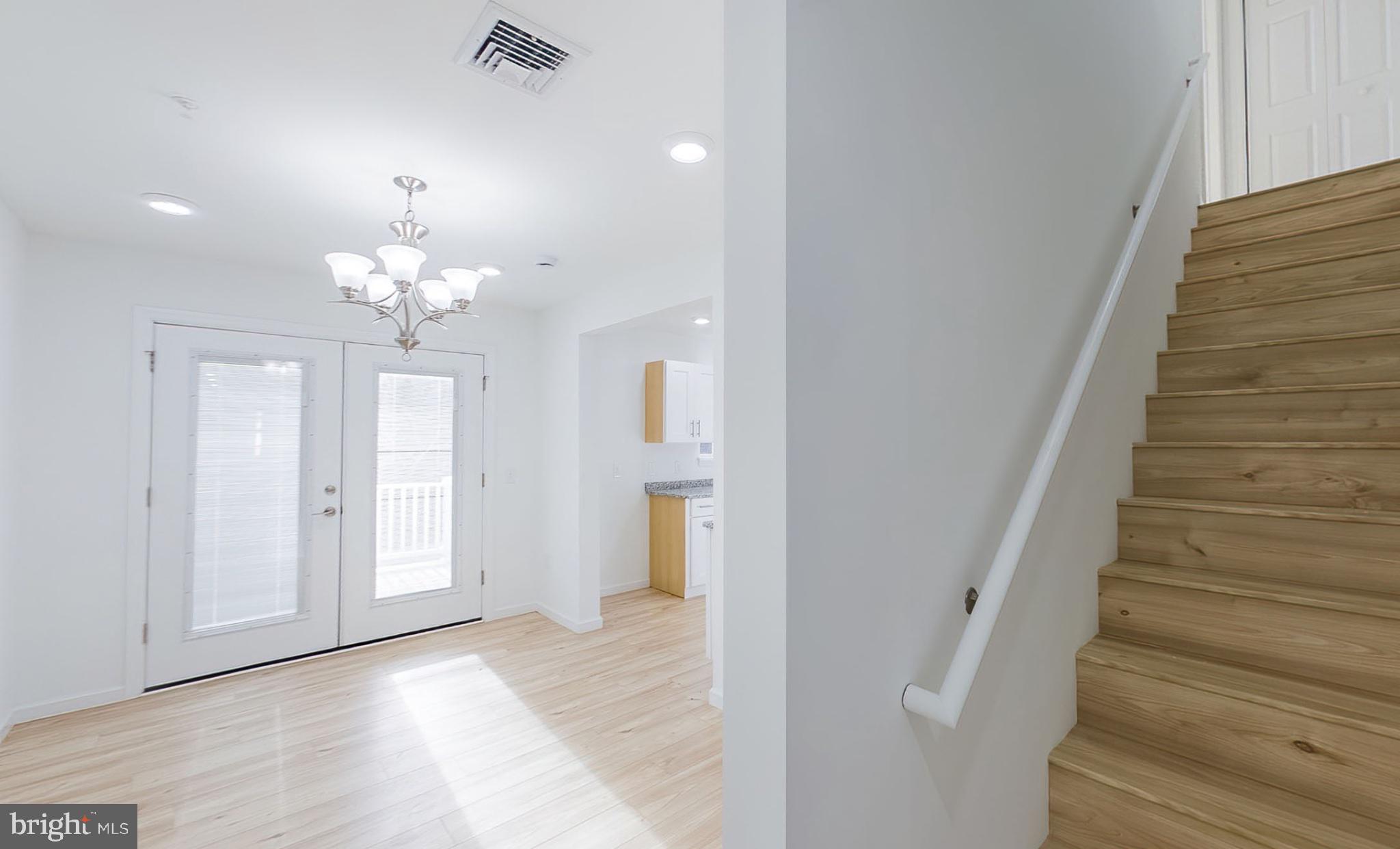 13 Nicole Lane Hazleton, PA 18202 - Photo 18 of 23 a view of a hallway with wooden floor and staircase