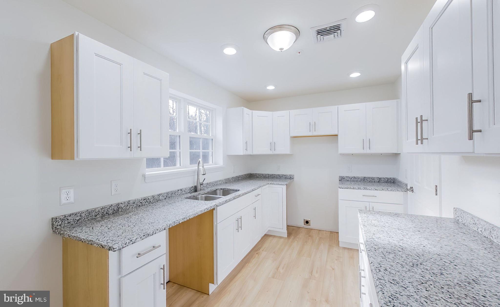 13 Nicole Lane Hazleton, PA 18202 - Photo 20 of 23 a kitchen with stainless steel appliances granite countertop a sink stove and cabinets