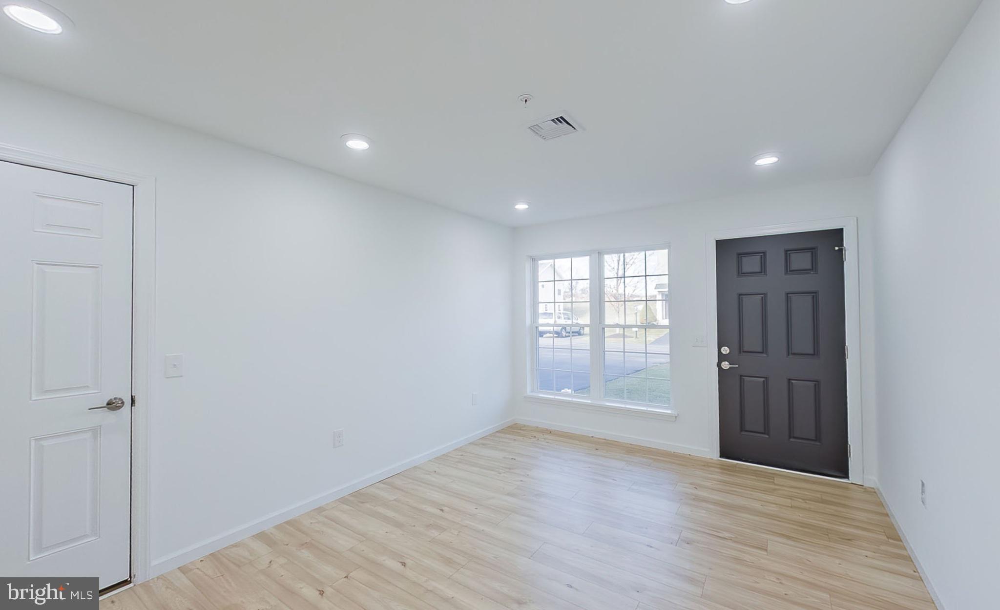 13 Nicole Lane Hazleton, PA 18202 - Photo 22 of 23 a view of an empty room with wooden floor and a window