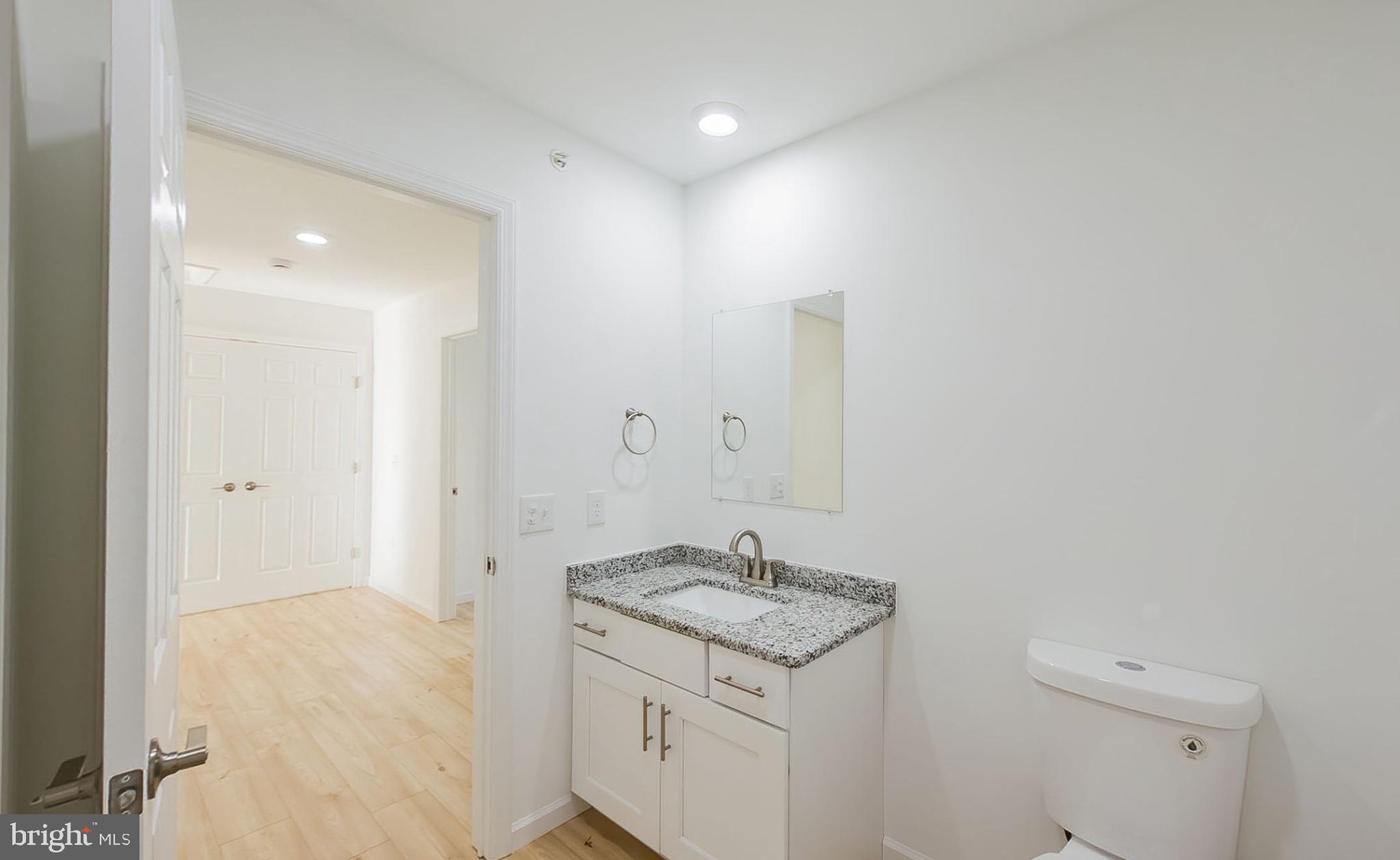 13 Nicole Lane Hazleton, PA 18202 - Photo 7 of 23 a bathroom with a granite countertop sink and a mirror