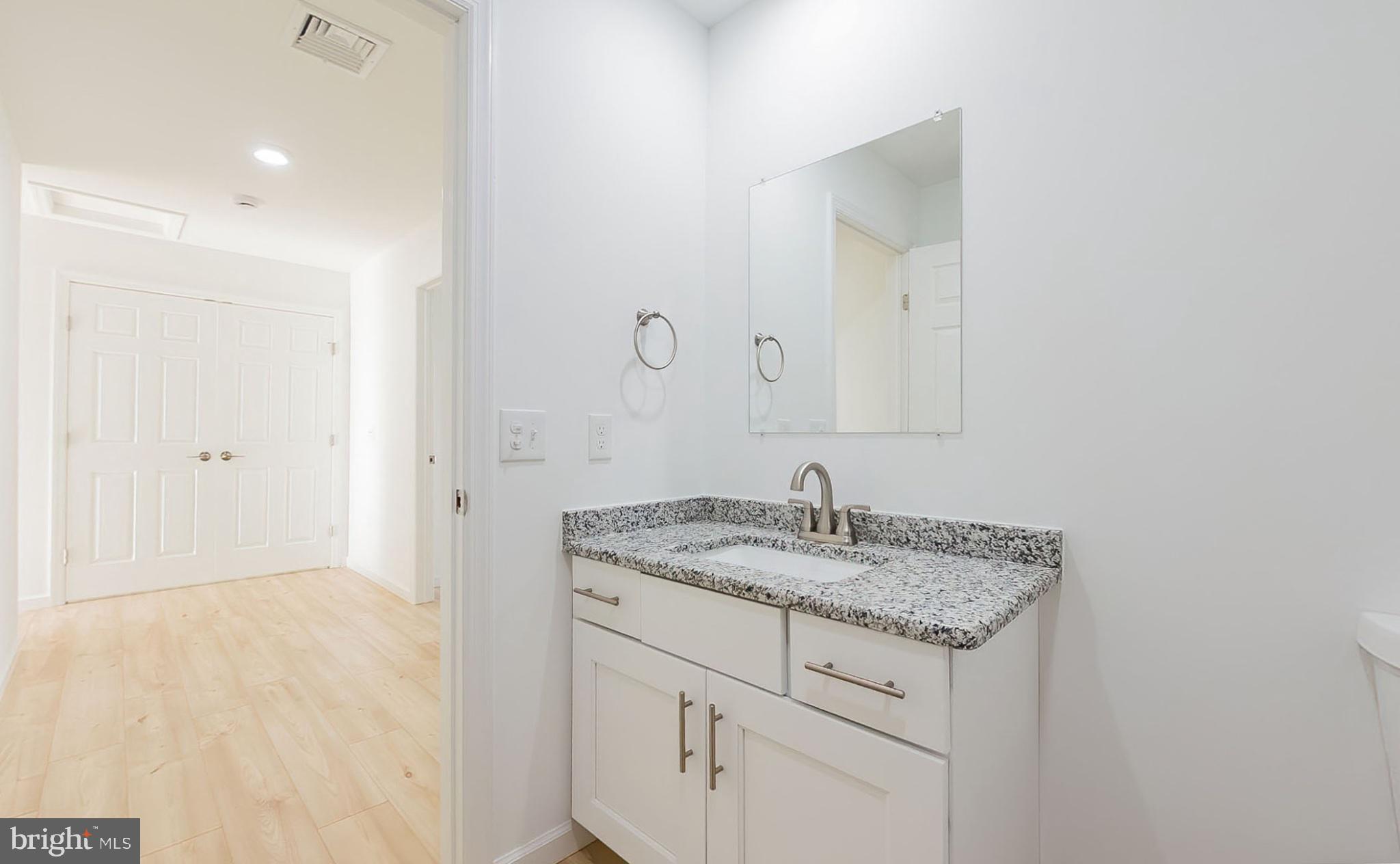 13 Nicole Lane Hazleton, PA 18202 - Photo 8 of 23 a bathroom with a granite countertop sink and a mirror