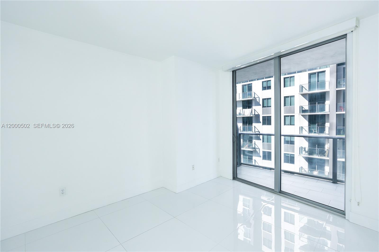 1010 Southwest 2nd Avenue, Unit 606 Miami, FL 33130 - Photo 12 of 46 a view of an empty room with a window