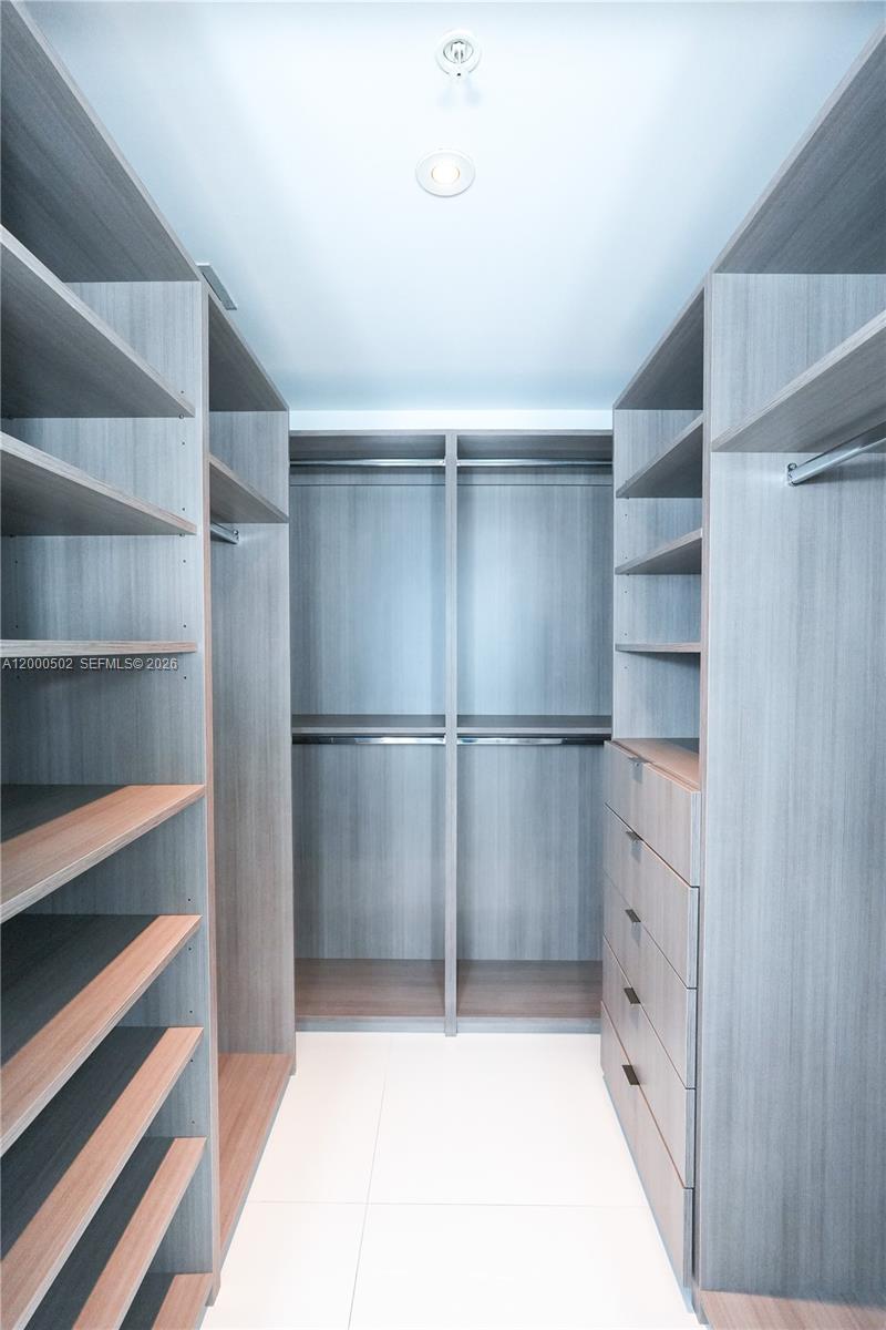 1010 Southwest 2nd Avenue, Unit 606 Miami, FL 33130 - Photo 14 of 46 a room with walk in closet and empty racks