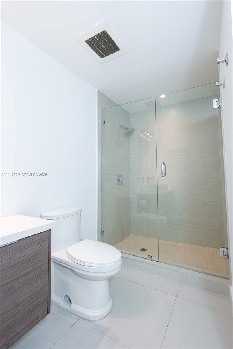 1010 Southwest 2nd Avenue, Unit 606 Miami, FL 33130 - Photo 16 of 46 a bathroom with a toilet and a shower