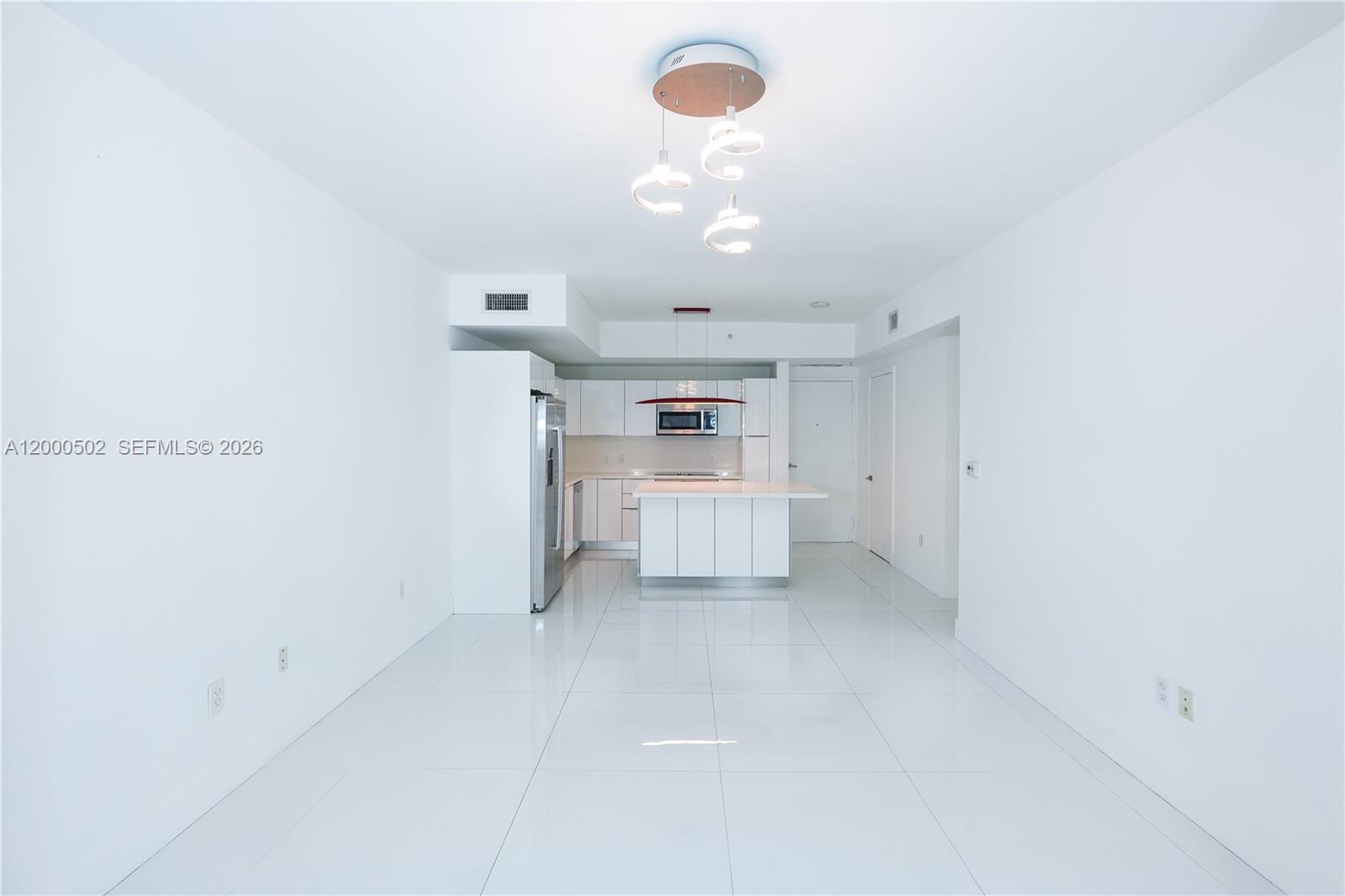 1010 Southwest 2nd Avenue, Unit 606 Miami, FL 33130 - Photo 2 of 46 a view of a kitchen with a dishwasher and cabinets