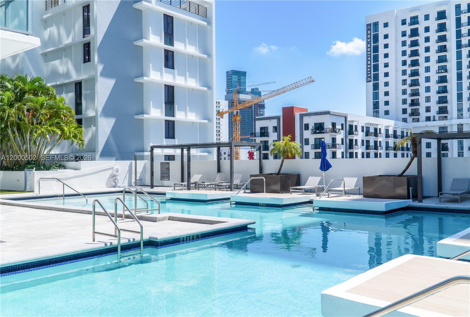 1010 Southwest 2nd Avenue, Unit 606 Miami, FL 33130 - Photo 30 of 46 a view of a swimming pool with outdoor seating