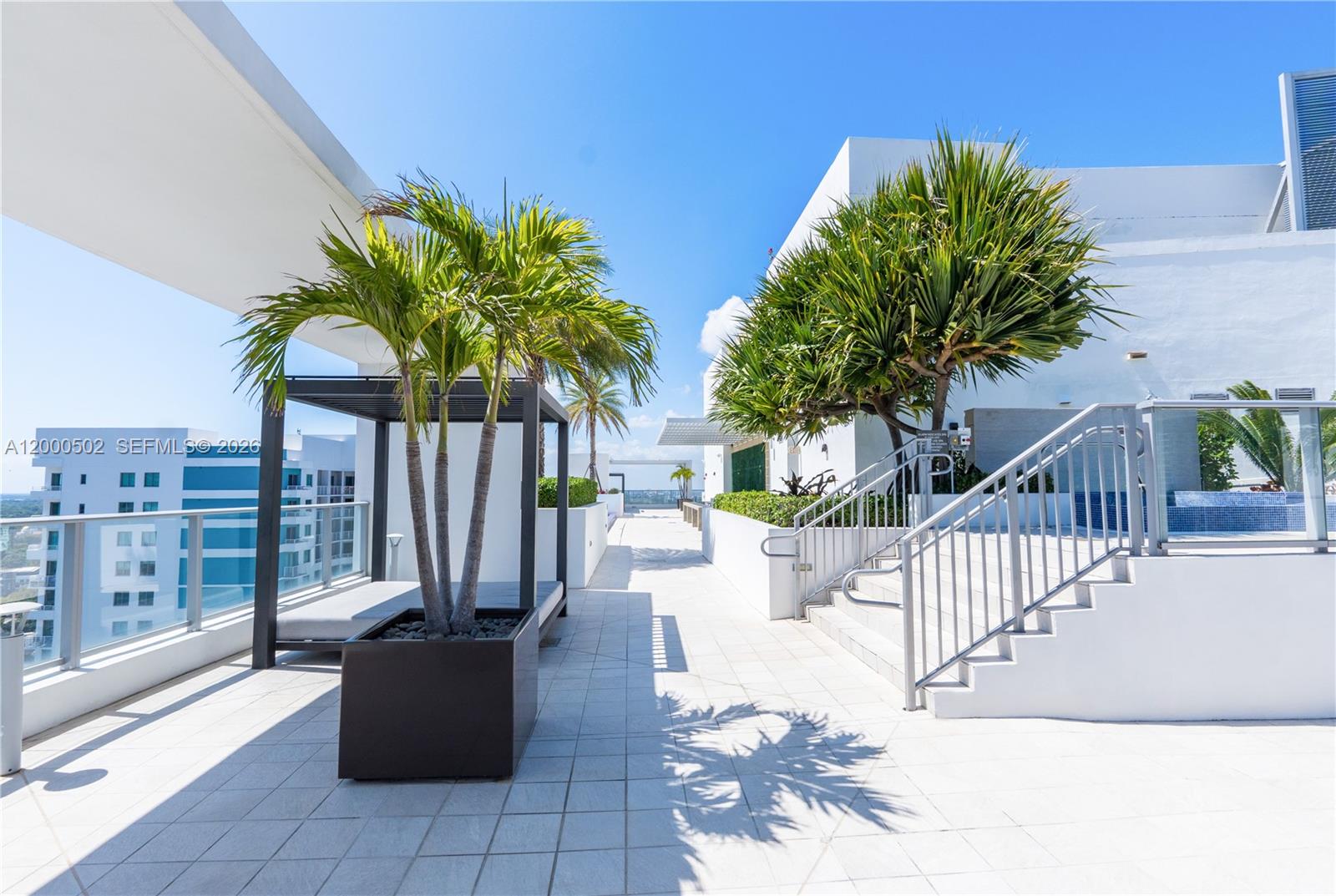 1010 Southwest 2nd Avenue, Unit 606 Miami, FL 33130 - Photo 35 of 46 a view of a chair and tables in the patio