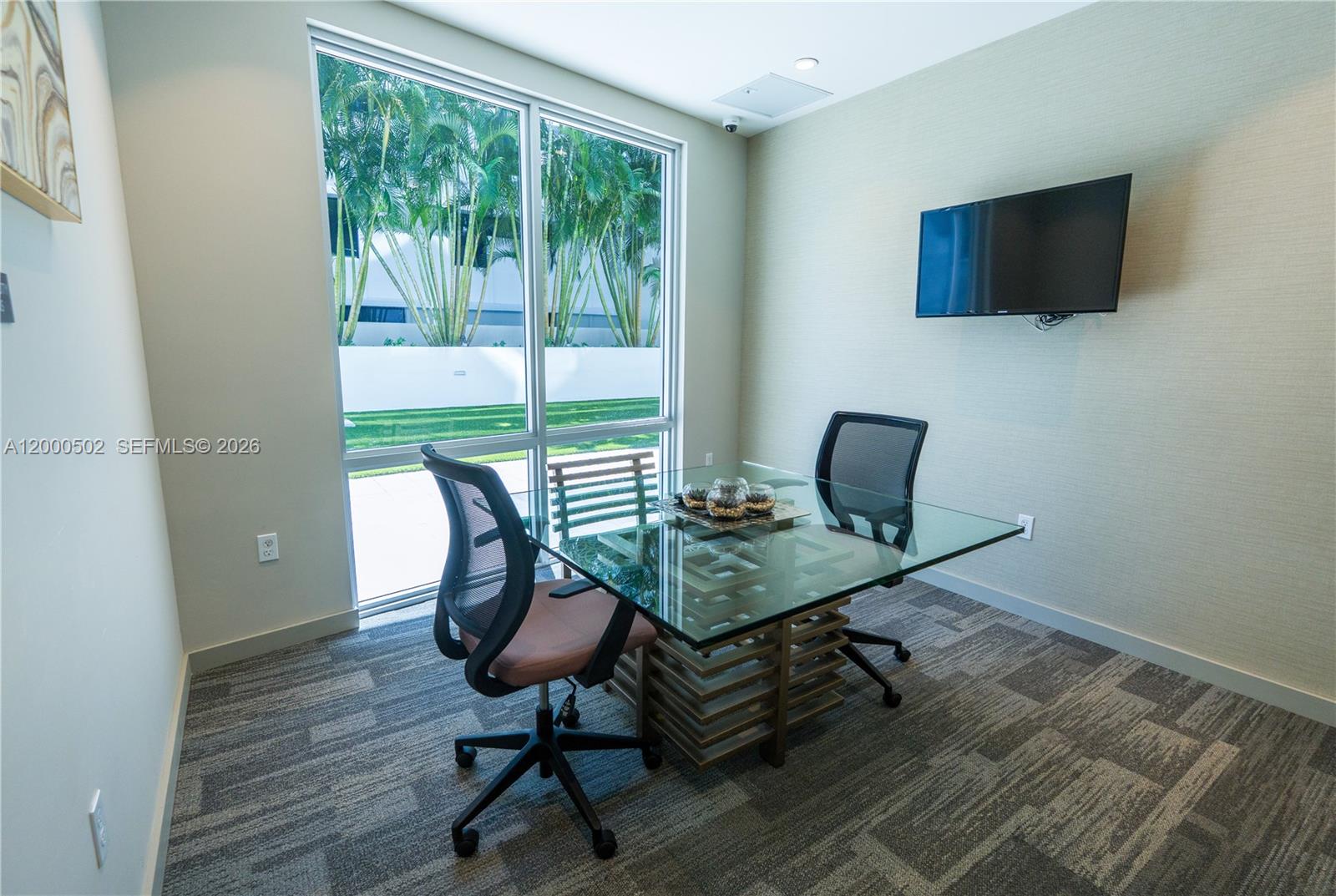 1010 Southwest 2nd Avenue, Unit 606 Miami, FL 33130 - Photo 43 of 46 a view of a workspace with furniture and a window