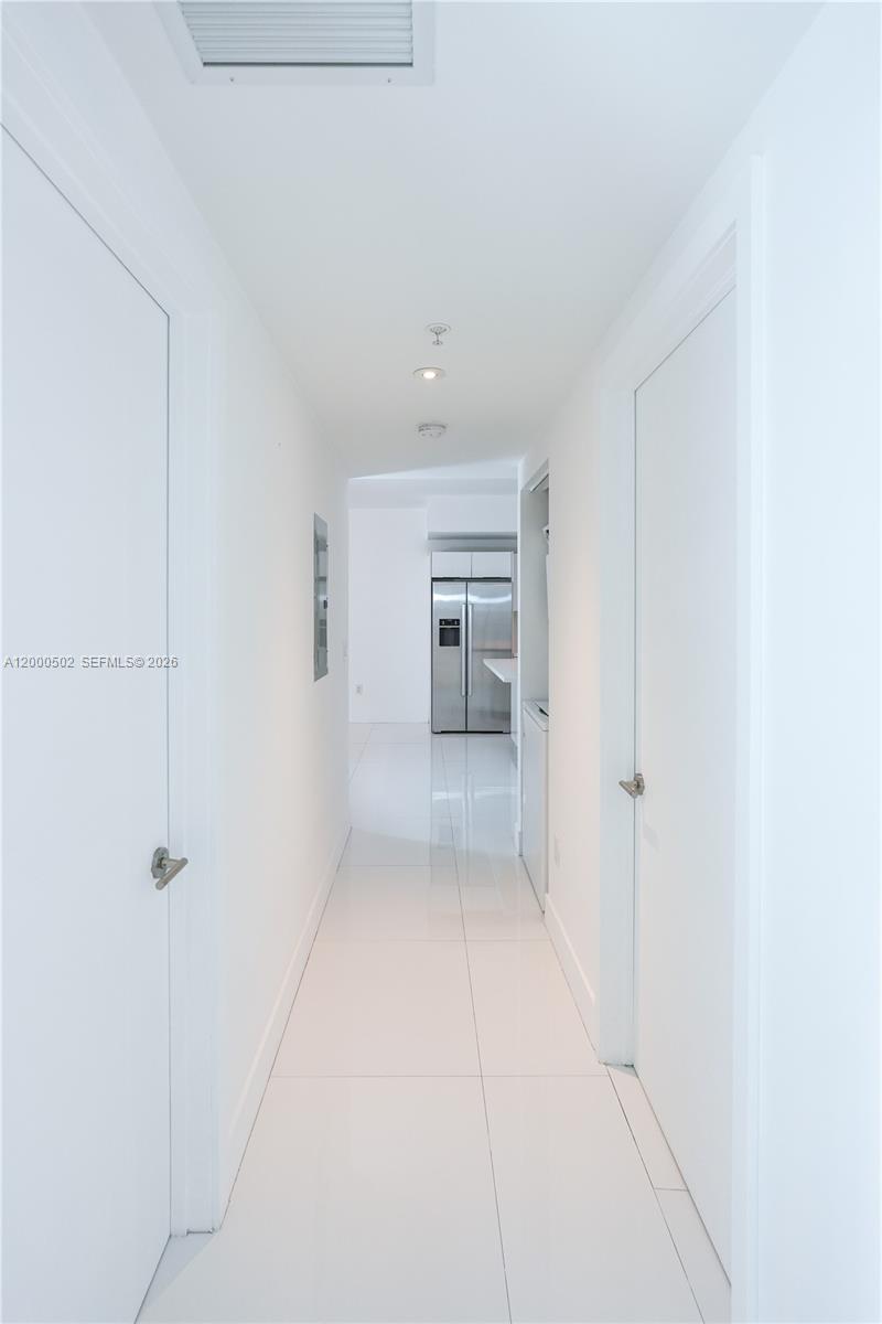 1010 Southwest 2nd Avenue, Unit 606 Miami, FL 33130 - Photo 6 of 46 a hallway view with staircase