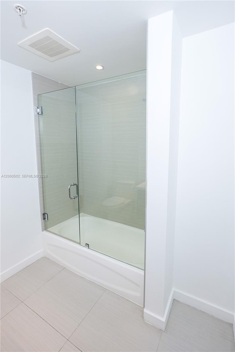 1010 Southwest 2nd Avenue, Unit 606 Miami, FL 33130 - Photo 10 of 46 a bathroom with a bathtub and shower
