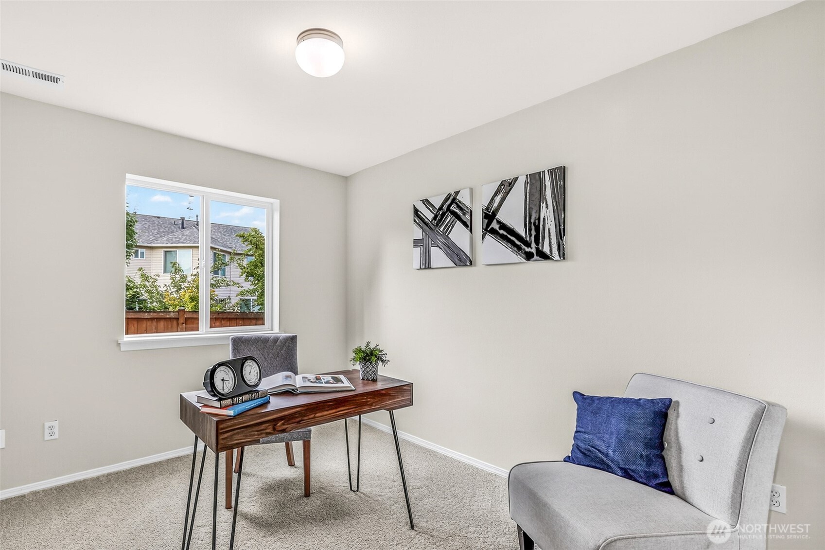 3918 152nd Place Southeast Bothell, WA 98012 - Photo 21 of 31 a view of a workspace with furniture and a window