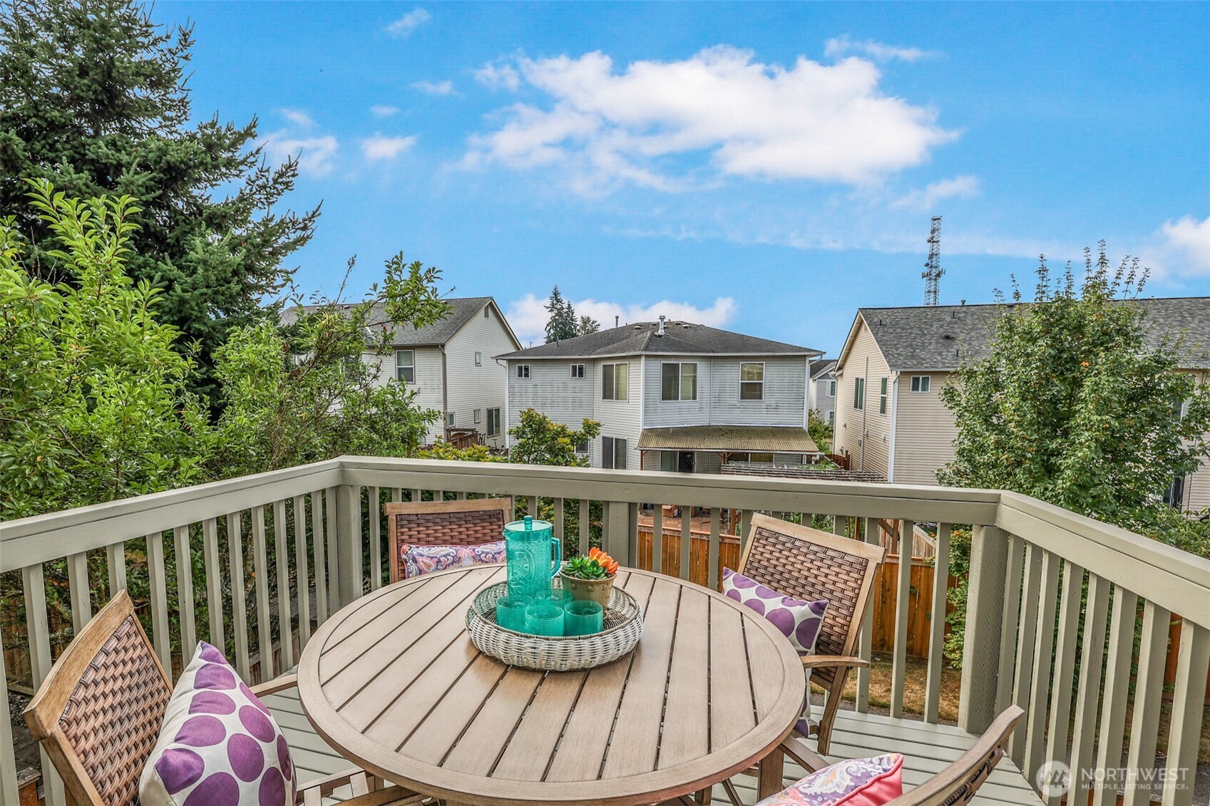3918 152nd Place Southeast Bothell, WA 98012 - Photo 25 of 31 a balcony with wooden floor table and chairs