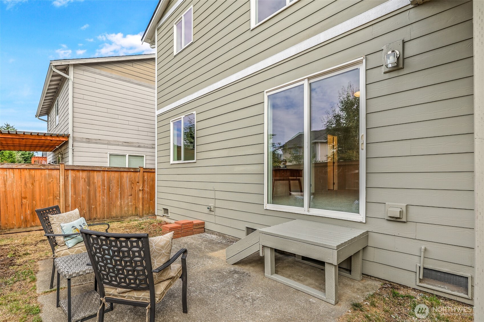 3918 152nd Place Southeast Bothell, WA 98012 - Photo 27 of 31 a backyard of a house with table and chairs