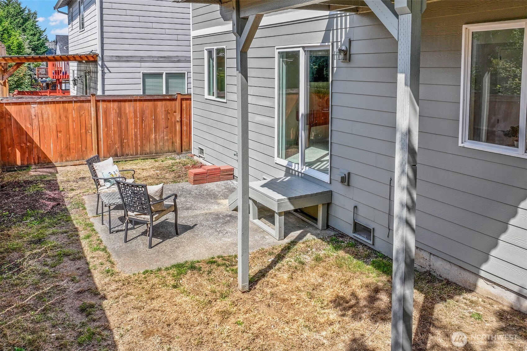 3918 152nd Place Southeast Bothell, WA 98012 - Photo 28 of 31 a view of backyard with a chair and table