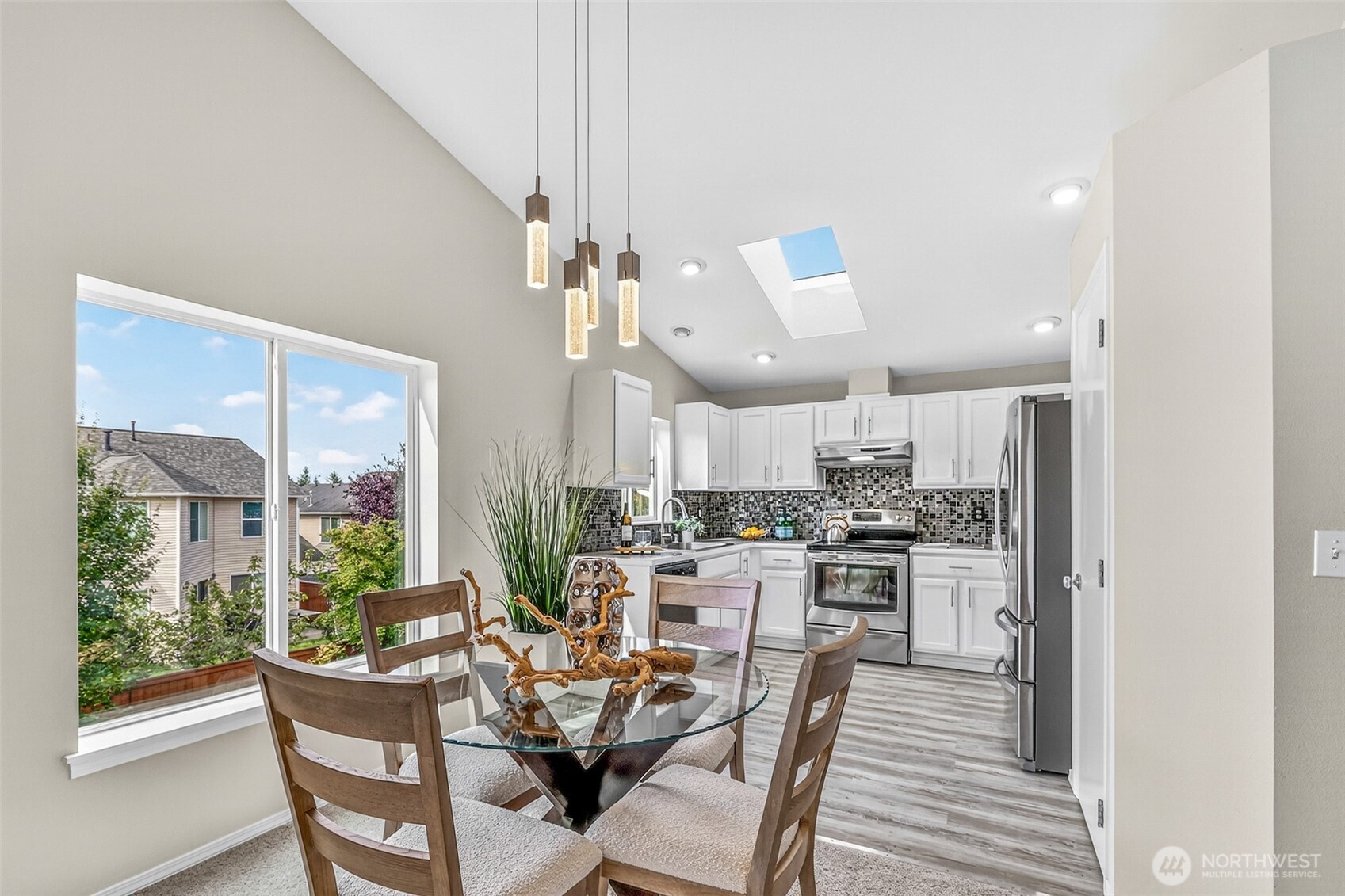 3918 152nd Place Southeast Bothell, WA 98012 - Photo 6 of 31 a view of a dining room with furniture window and wooden floor