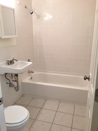 46 Adams Street, Unit A6 Boston, MA 02122 - Photo 11 of 11 a bathroom with a toilet a sink and bathtub