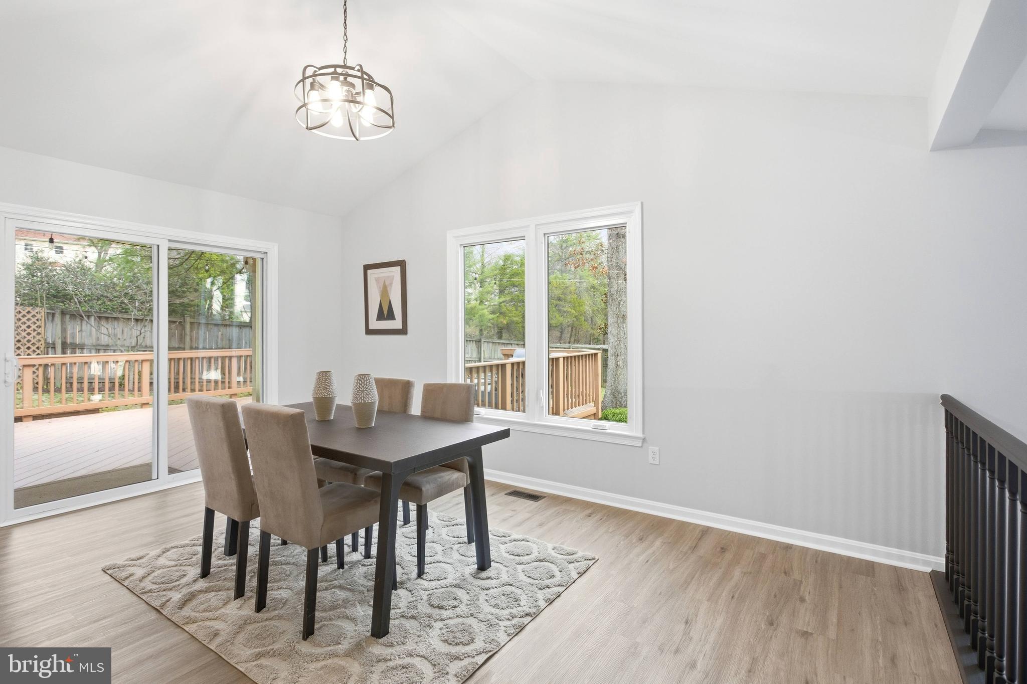 7400 Dorothy Court Springfield, VA 22153 - Photo 14 of 54 a view of a dining room with furniture wooden floor and a flat screen tv