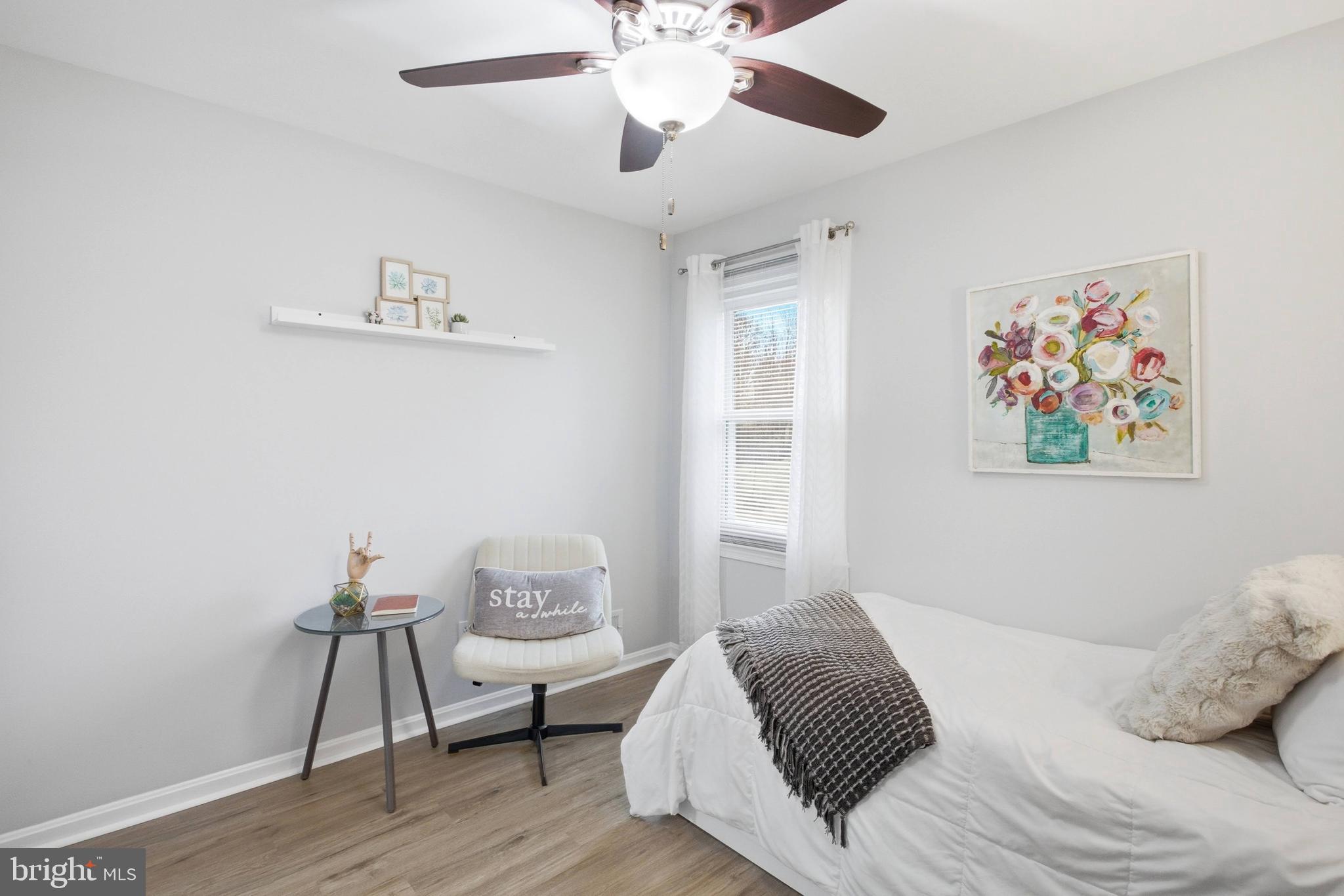 7400 Dorothy Court Springfield, VA 22153 - Photo 22 of 54 a bedroom with a bed and wooden floor