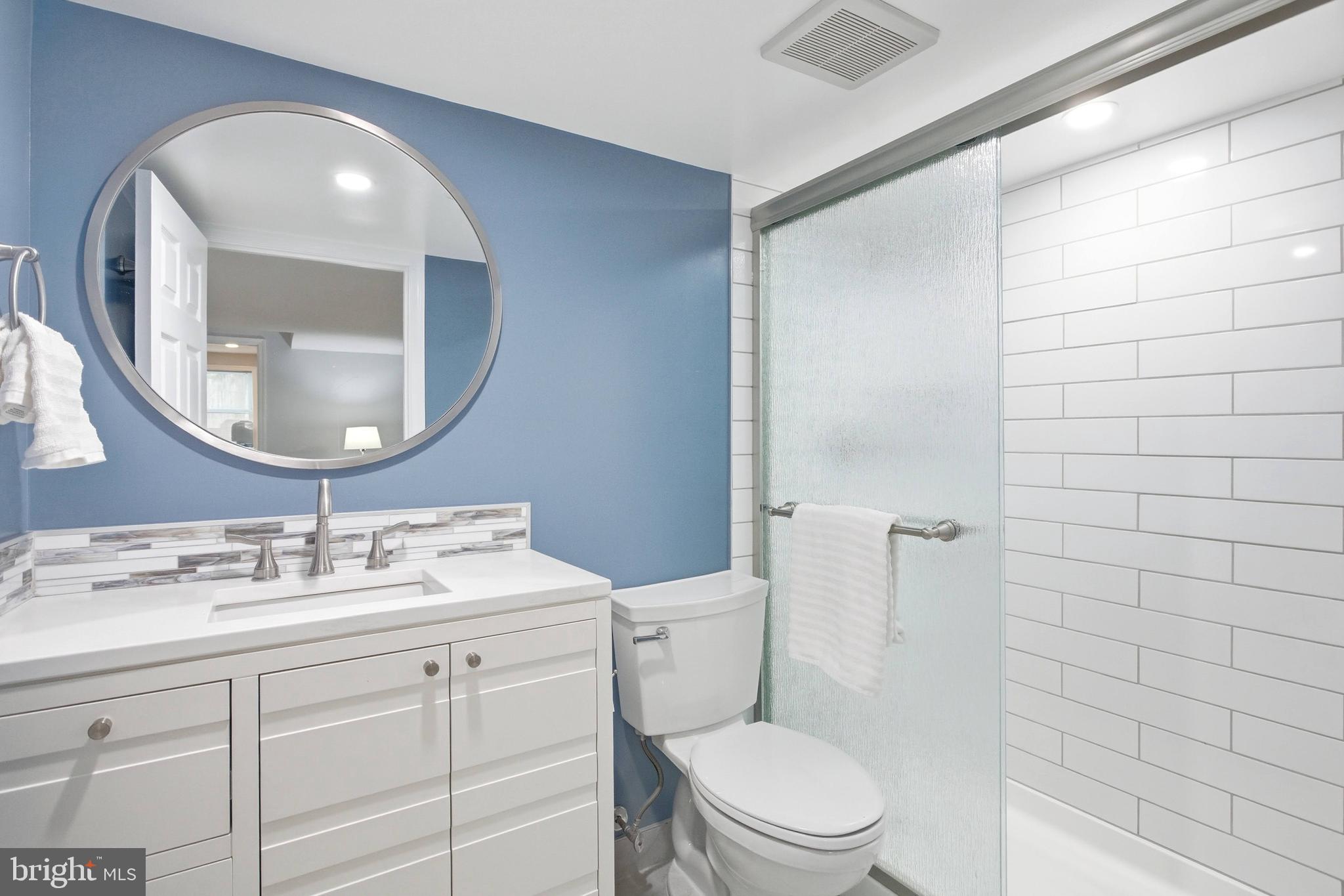 7400 Dorothy Court Springfield, VA 22153 - Photo 26 of 54 a bathroom with a toilet a sink and mirror