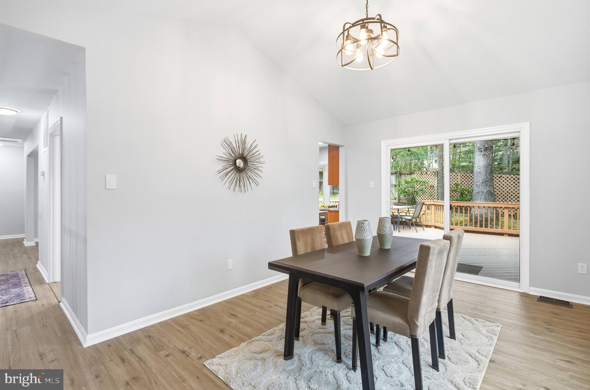 7400 Dorothy Court Springfield, VA 22153 - Photo 5 of 54 a dining room with wooden floor and a chandelier