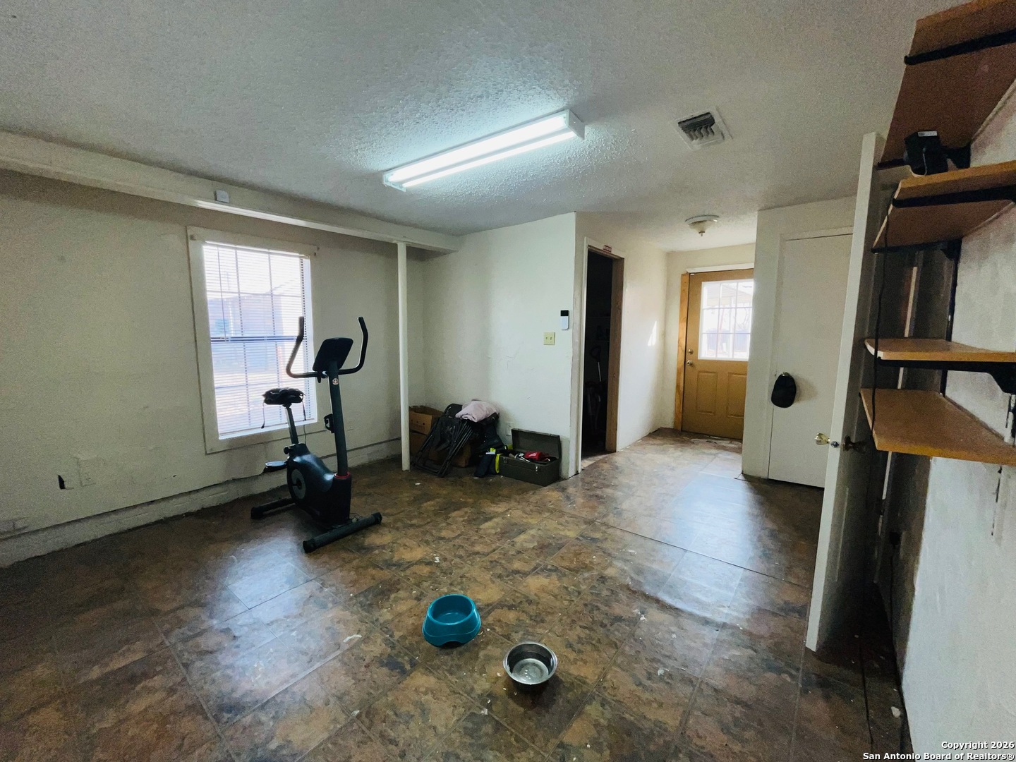 200 West Frio Street Dilley, TX 78017 - Photo 13 of 18 a view of a livingroom with furniture and a ceiling fan