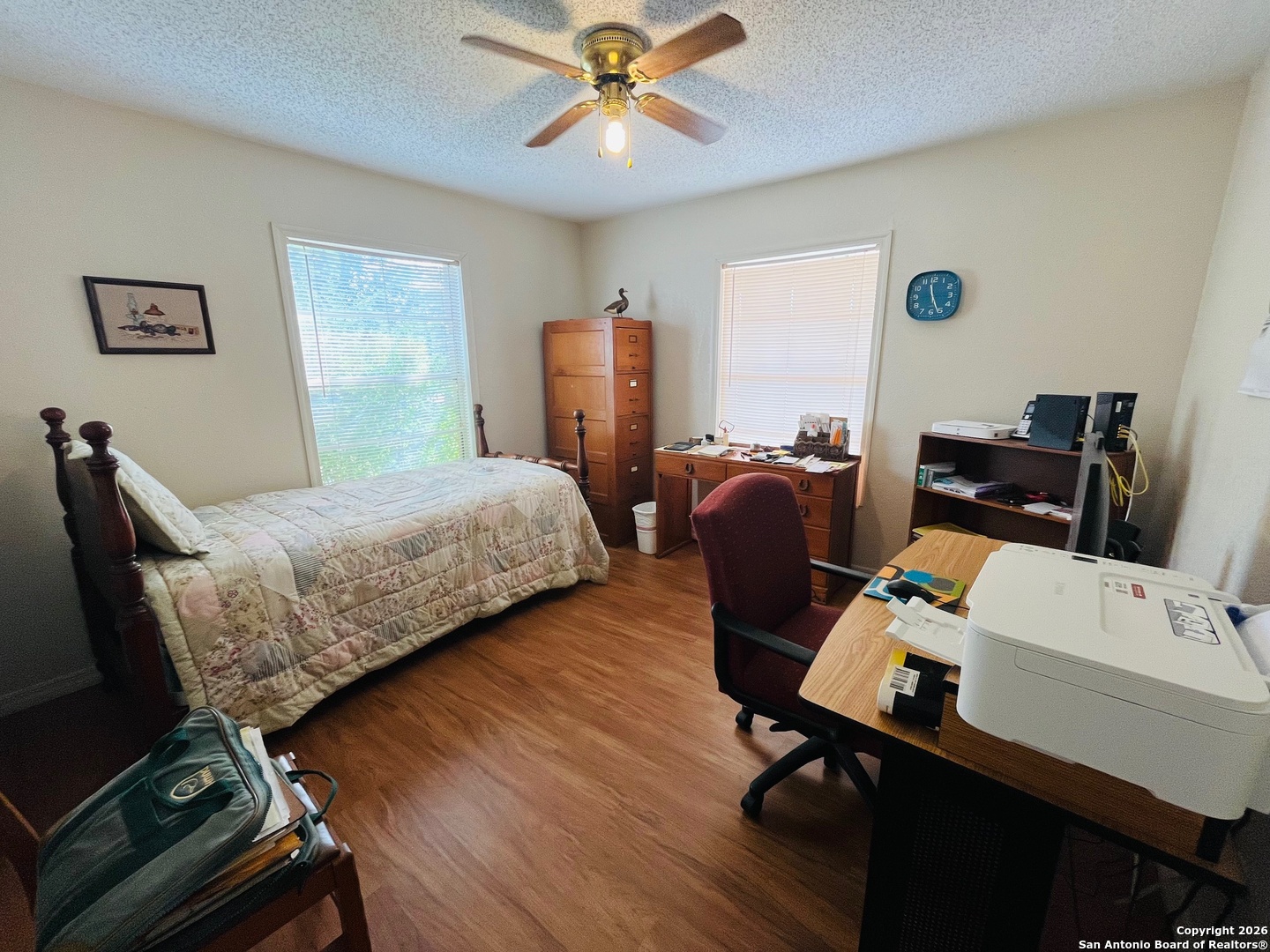 200 West Frio Street Dilley, TX 78017 - Photo 5 of 18 a bedroom with a workspace