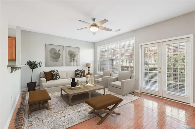 a living room with furniture and a large window