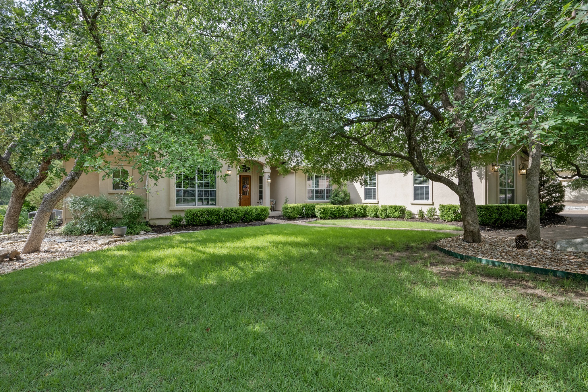 29 Meadows End Georgetown, TX 78628 - Photo 2 of 38 a view of a house next to a big yard and large trees