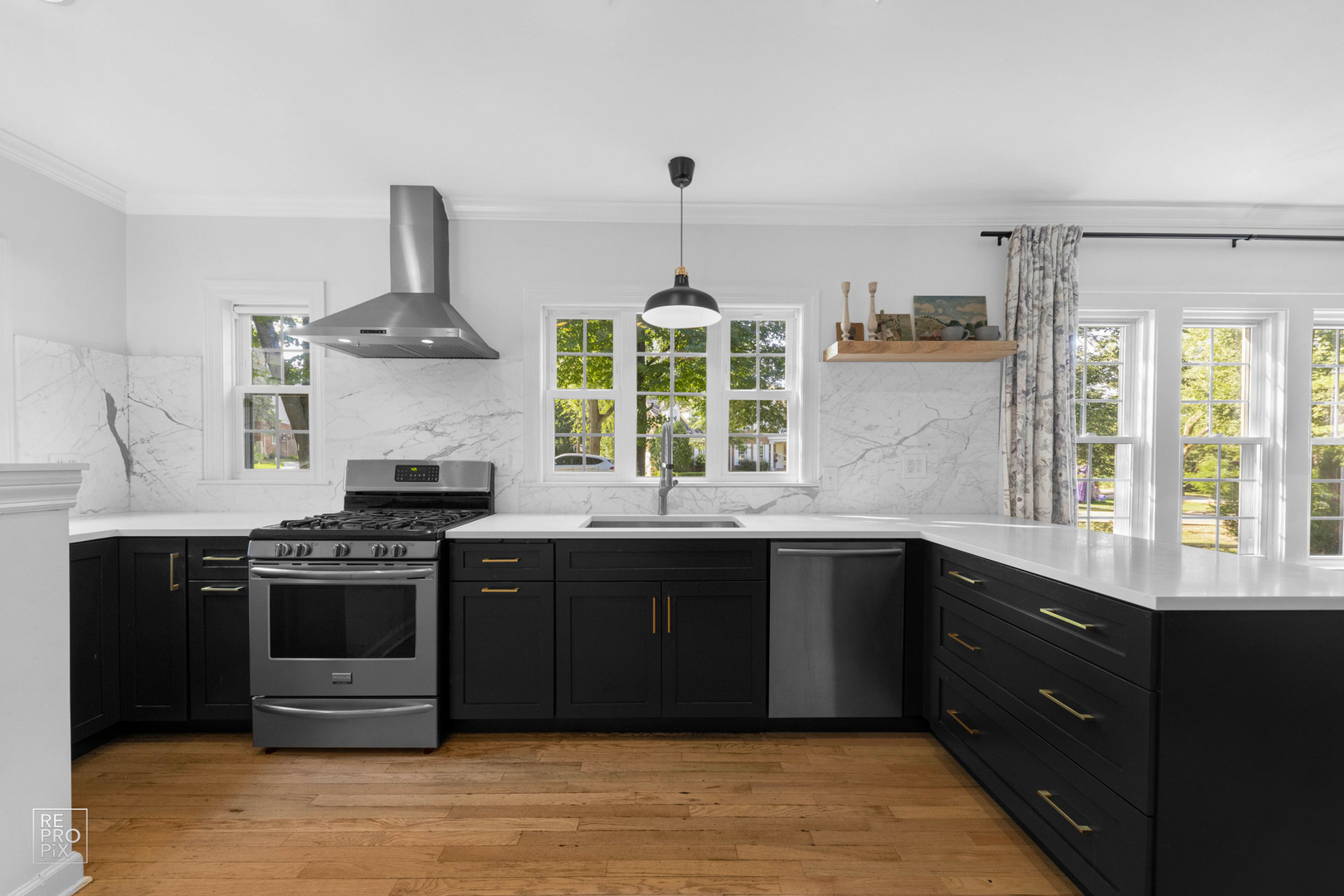 352 Ridge Avenue Clarendon Hills, IL 60514 - Photo 11 of 31 a kitchen with a stove and a sink
