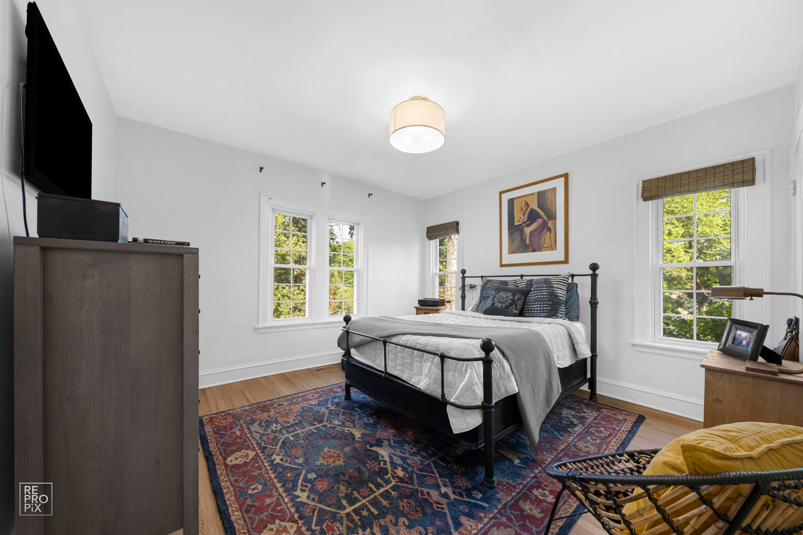 352 Ridge Avenue Clarendon Hills, IL 60514 - Photo 14 of 31 a spacious bedroom with a bed and a flat screen tv