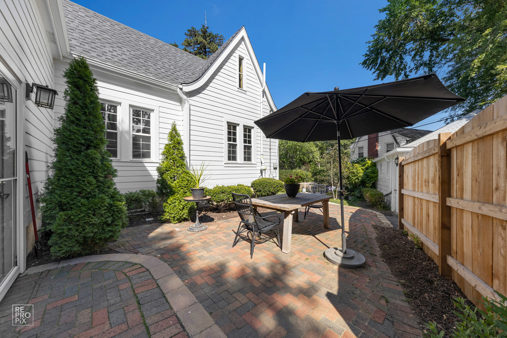 352 Ridge Avenue Clarendon Hills, IL 60514 - Photo 27 of 31 a view of backyard with outdoor seating and trees