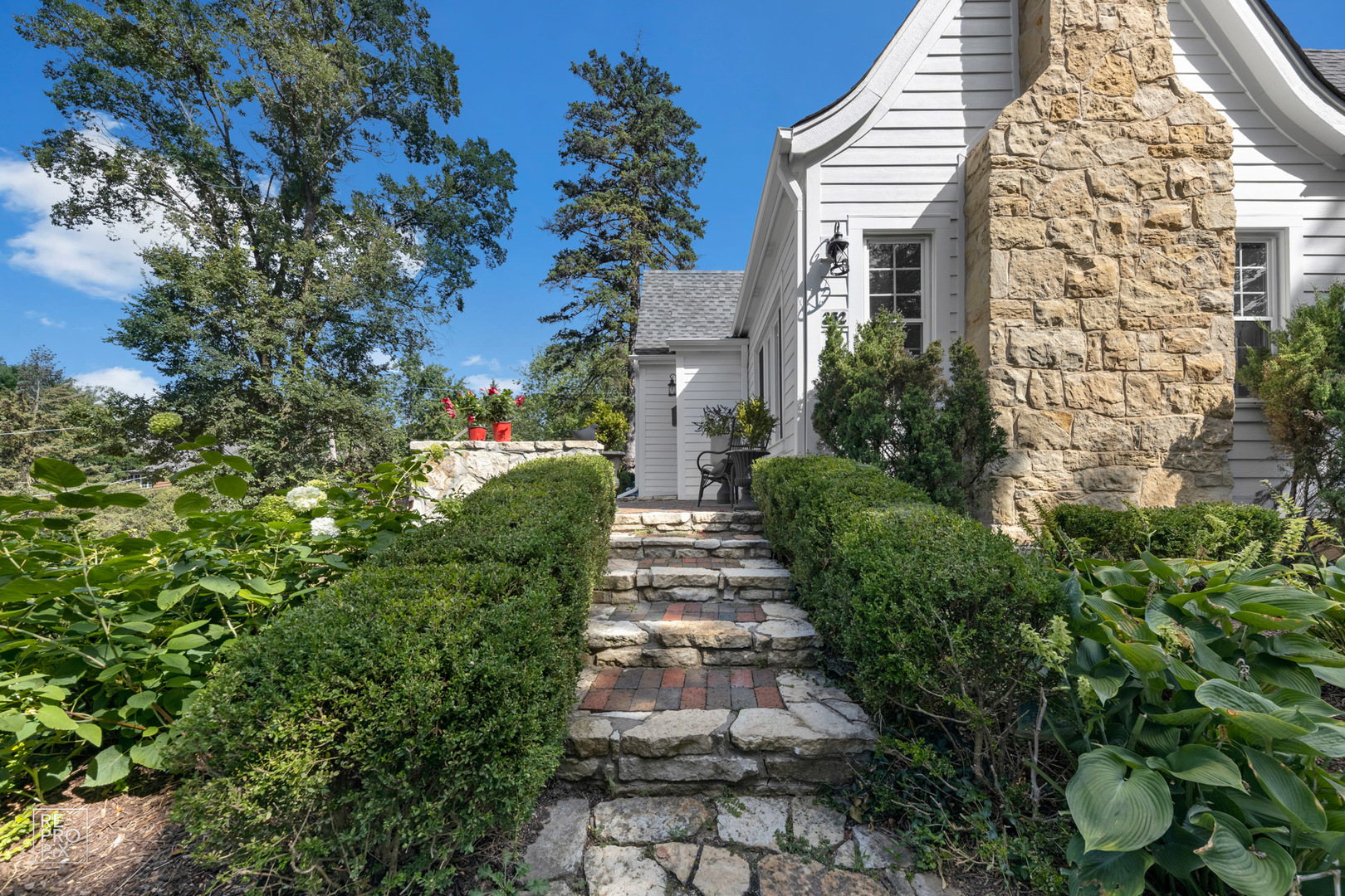 352 Ridge Avenue Clarendon Hills, IL 60514 - Photo 5 of 31 a view of a pathway with flower plants