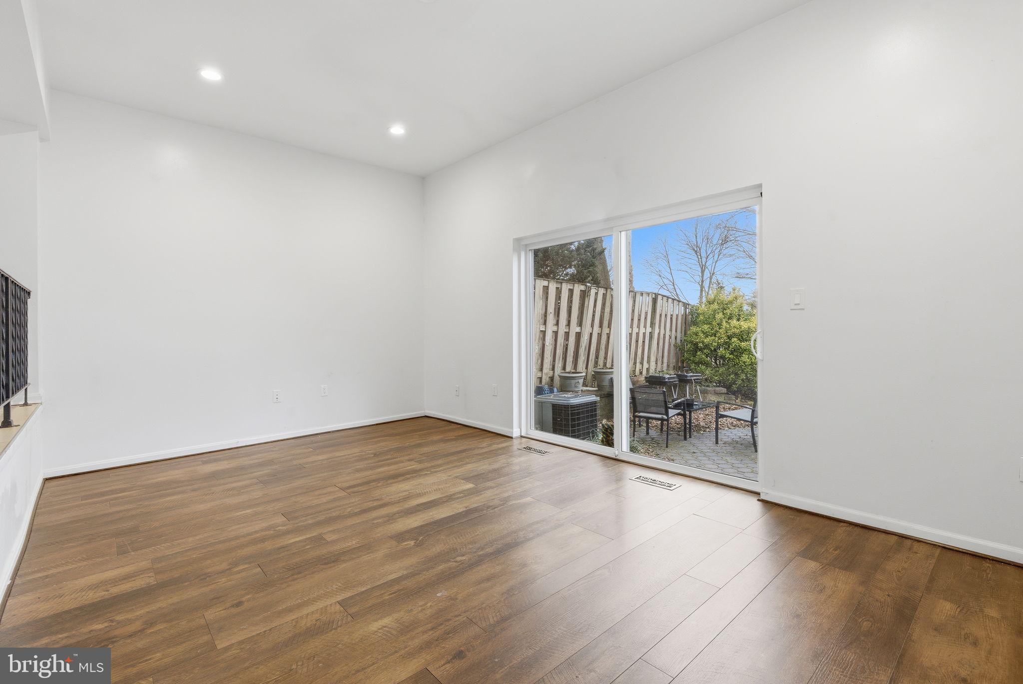 11072 Berrypick Lane Columbia, MD 21044 - Photo 11 of 35 a view of an empty room with wooden floor