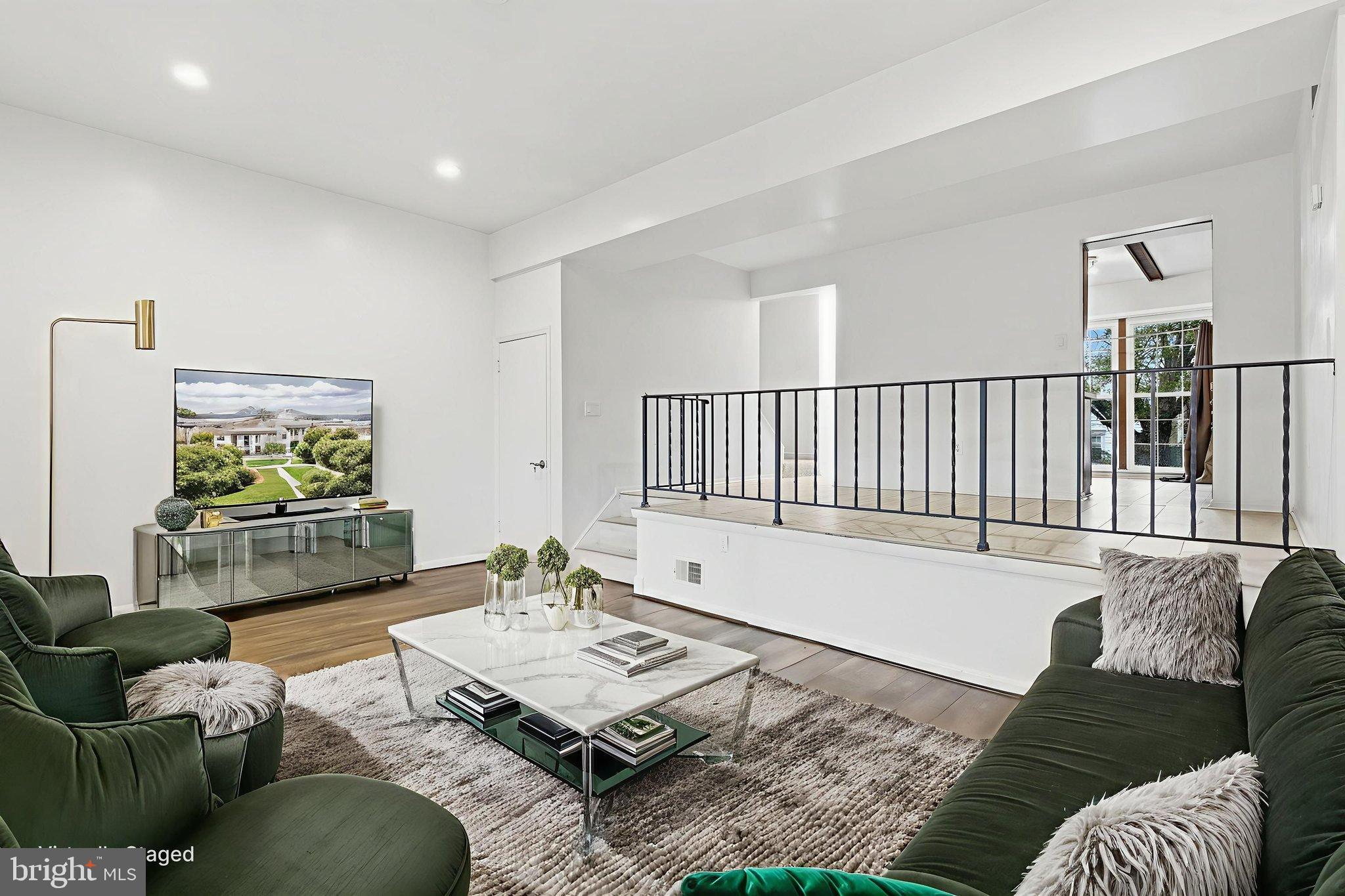 11072 Berrypick Lane Columbia, MD 21044 - Photo 14 of 35 a living room with furniture and a rug