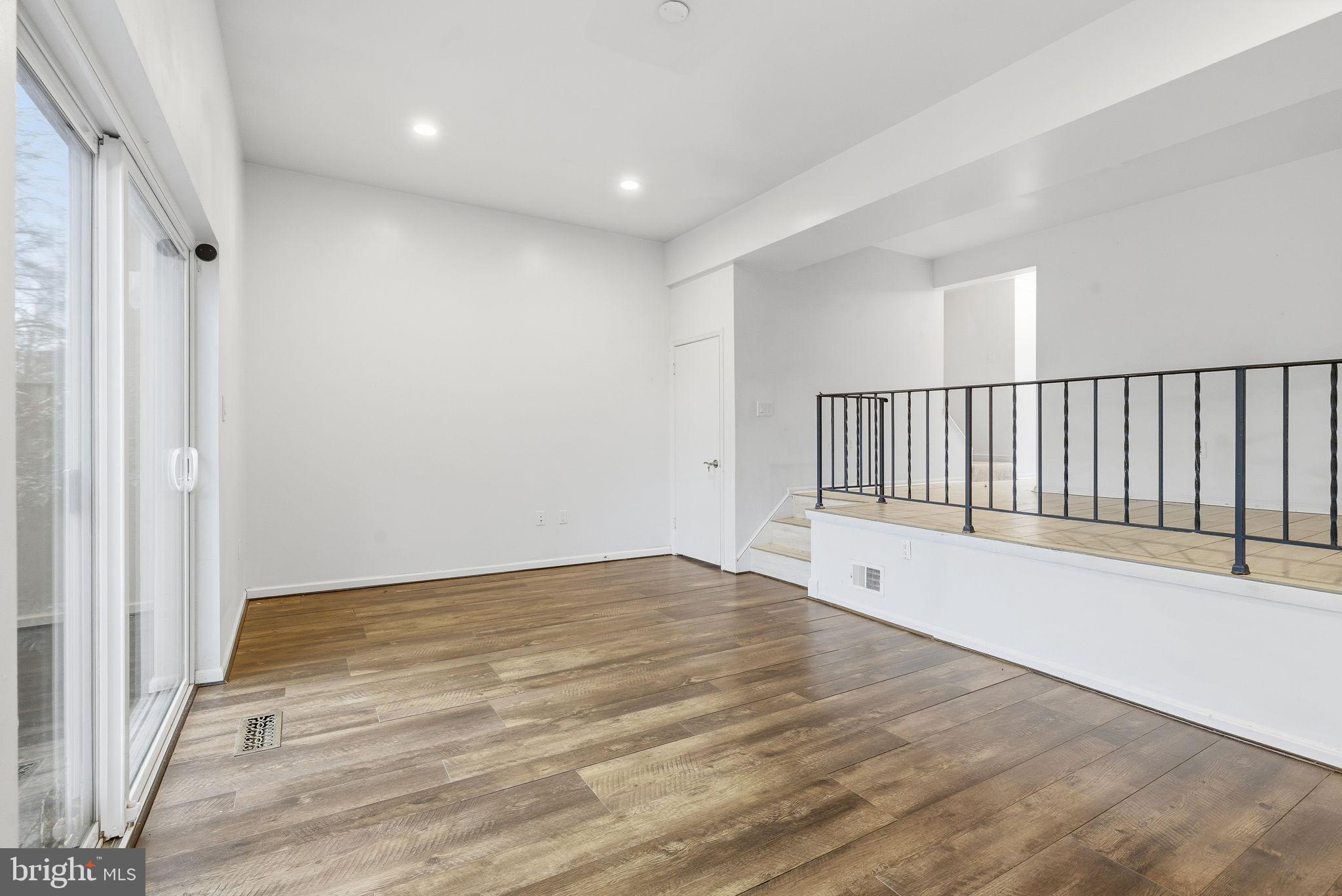 11072 Berrypick Lane Columbia, MD 21044 - Photo 15 of 35 a view of an empty room with wooden floor