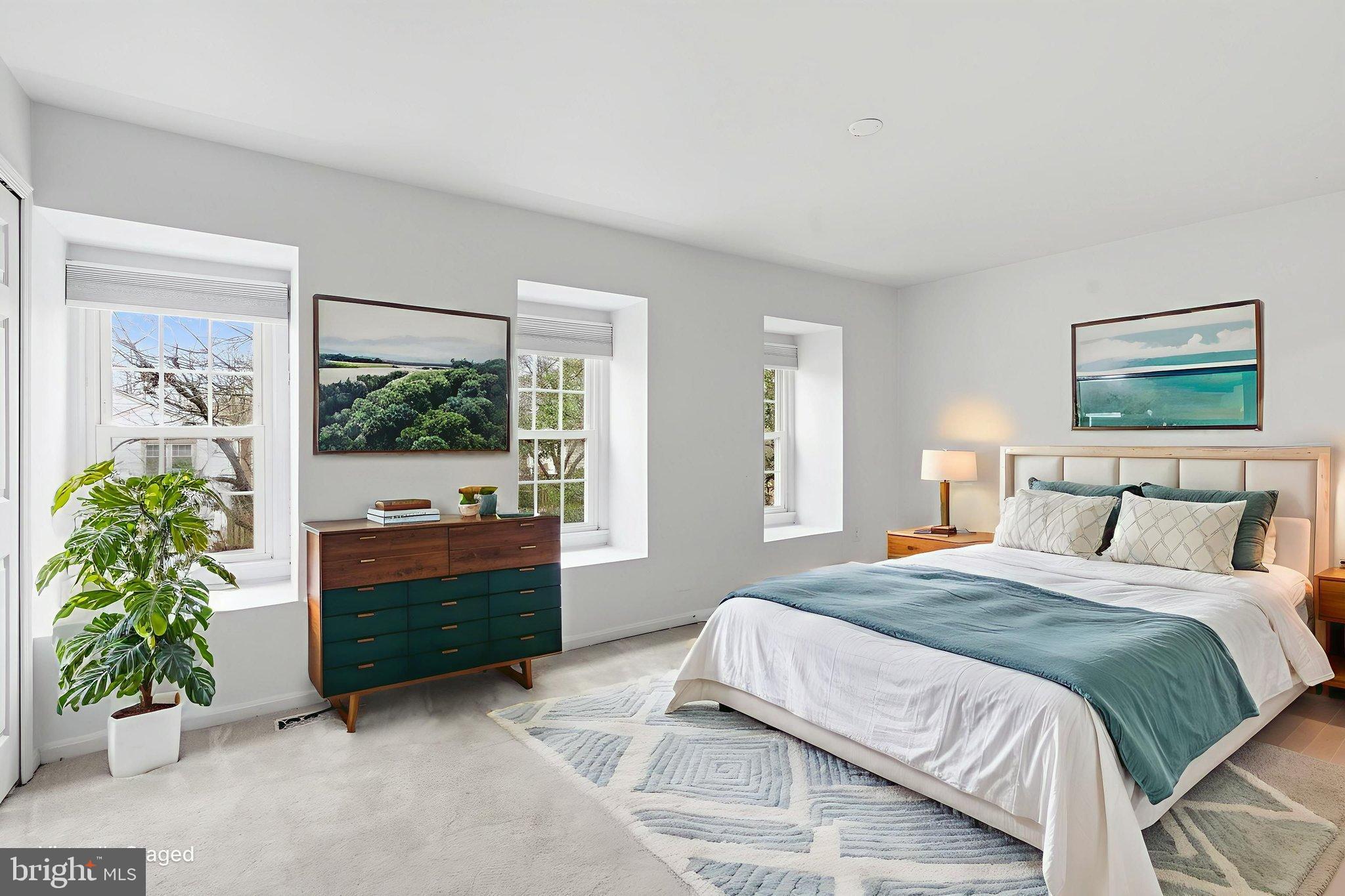 11072 Berrypick Lane Columbia, MD 21044 - Photo 24 of 35 a spacious bedroom with a bed and a window