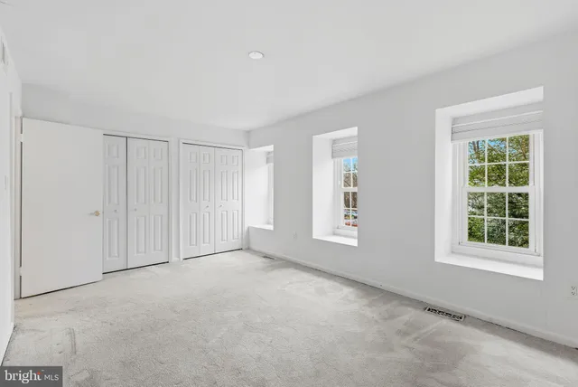 an empty room with windows